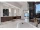 Modern bathroom with dark marble and floating vanity at 1480 Macdonald Ranch Dr, Henderson, NV 89012