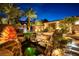 Relaxing courtyard with brick flooring, fireplace, and seating at 1480 Macdonald Ranch Dr, Henderson, NV 89012