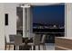 Elegant dining area with glass table and city views at 1480 Macdonald Ranch Dr, Henderson, NV 89012