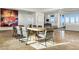 Bright dining room with long table and modern chairs at 1480 Macdonald Ranch Dr, Henderson, NV 89012