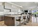 Modern kitchen with large island and marble countertops at 1480 Macdonald Ranch Dr, Henderson, NV 89012