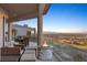 Relaxing patio with fire pit and breathtaking panoramic views at 1480 Macdonald Ranch Dr, Henderson, NV 89012