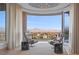 Relaxing sitting area with panoramic views and access to balcony at 1480 Macdonald Ranch Dr, Henderson, NV 89012