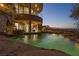 Stunning pool with a view of the city skyline at night at 1480 Macdonald Ranch Dr, Henderson, NV 89012