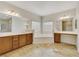 Luxurious bathroom with a large soaking tub and double vanity at 167 Rising Mesa Ct, Henderson, NV 89012