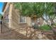 The beautiful backyard includes a rock garden, trees, and desert landscaping at 2033 Old Field Ave, North Las Vegas, NV 89081