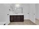 Bathroom featuring dual sinks, tiled floors and a doorway view to a separate room at 2033 Old Field Ave, North Las Vegas, NV 89081