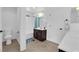 Bathroom featuring a shower-tub combo and sleek vanity with abundant lighting fixtures at 2033 Old Field Ave, North Las Vegas, NV 89081