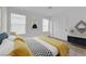 Stylish bedroom featuring large windows, closet, and chic decor at 2033 Old Field Ave, North Las Vegas, NV 89081