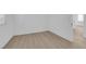 An empty bedroom featuring light wood floors and ample lighting at 2033 Old Field Ave, North Las Vegas, NV 89081