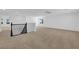 Spacious upstairs bonus room featuring neutral walls, plush carpet and black iron banister at 2033 Old Field Ave, North Las Vegas, NV 89081