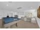 Spacious upstairs bonus room featuring a pool table, chairs and lots of natural light at 2033 Old Field Ave, North Las Vegas, NV 89081