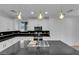 Bright kitchen featuring stainless steel appliances, and black countertops at 2033 Old Field Ave, North Las Vegas, NV 89081