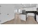 Bright kitchen featuring stainless steel appliances, black countertops, and white cabinets at 2033 Old Field Ave, North Las Vegas, NV 89081