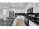 Bright kitchen featuring stainless steel appliances, and black countertops at 2033 Old Field Ave, North Las Vegas, NV 89081