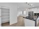 Bright kitchen with stainless steel appliances, pantry and stylish pendant lighting at 2033 Old Field Ave, North Las Vegas, NV 89081