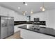 Bright kitchen featuring stainless steel appliances, and black countertops at 2033 Old Field Ave, North Las Vegas, NV 89081