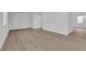 Bright living room featuring neutral walls, wood flooring and lots of natural light at 2033 Old Field Ave, North Las Vegas, NV 89081