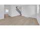 Bright living room featuring neutral walls, wood flooring and black iron banister at 2033 Old Field Ave, North Las Vegas, NV 89081