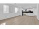 Open-concept living room with modern finishes, hardwood flooring and ample natural light at 2033 Old Field Ave, North Las Vegas, NV 89081