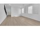 Bright living room featuring neutral walls, wood flooring and lots of natural light at 2033 Old Field Ave, North Las Vegas, NV 89081