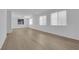 Spacious living room with large windows bringing in natural light at 2033 Old Field Ave, North Las Vegas, NV 89081