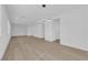 Bright living room featuring neutral walls, wood flooring and modern light fixture at 2033 Old Field Ave, North Las Vegas, NV 89081