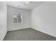 Well-lit bedroom with ceiling fan and carpeted floor at 2138 Ponticello Dr, Henderson, NV 89052