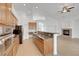 Kitchen features granite countertops and wood cabinets at 2138 Ponticello Dr, Henderson, NV 89052