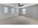 Bright bedroom with multiple windows providing natural light and neutral carpeting at 2347 Via Barranca St, Henderson, NV 89044