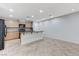 Modern kitchen with island, stainless steel appliances, and light wood cabinets at 2347 Via Barranca St, Henderson, NV 89044