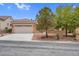 Single-story home with a two-car garage and desert landscaping at 2735 Fort Myer Ave, Henderson, NV 89052