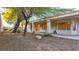Landscaped backyard with mature trees and patio at 2771 Fort Myer Ave, Henderson, NV 89052