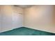 Bedroom with teal carpet and double door closet at 2771 Fort Myer Ave, Henderson, NV 89052