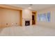 Living room with tile floors, fireplace, and built-in shelving at 2771 Fort Myer Ave, Henderson, NV 89052