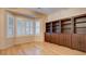 Bright office features hardwood floors, built-in shelving, and a bay window at 2771 Fort Myer Ave, Henderson, NV 89052