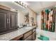 Clean bathroom with granite vanity and teal shower curtain at 2855 Geary Pl # 3205, Las Vegas, NV 89109