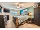 Main bedroom with dark wood furniture and teal accent wall at 2855 Geary Pl # 3205, Las Vegas, NV 89109