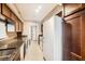 Modern kitchen with granite countertops and dark wood cabinets at 2855 Geary Pl # 3205, Las Vegas, NV 89109