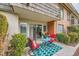 Private patio with red chairs and teal rug at 2855 Geary Pl # 3205, Las Vegas, NV 89109