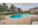 Relaxing kidney-shaped pool with patio furniture and views of a hotel at 2855 Geary Pl # 3205, Las Vegas, NV 89109