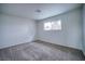 Well-lit bedroom with neutral walls, carpet flooring and window at 3117 High View Dr, Henderson, NV 89014