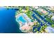 Aerial view of community with lake, pool, and homes at 3150 Soft Breezes Dr # 2025, Las Vegas, NV 89128