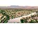 Aerial view of Desert Shores community with lake and mountain views at 3150 Soft Breezes Dr # 2025, Las Vegas, NV 89128