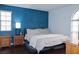 Spacious main bedroom with wood floors and large window at 3150 Soft Breezes Dr # 2025, Las Vegas, NV 89128