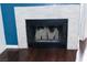 Modern fireplace with a clean, light stone surround at 3150 Soft Breezes Dr # 2025, Las Vegas, NV 89128