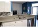 Modern kitchen with gray countertops, stainless steel appliances, and white cabinets at 3150 Soft Breezes Dr # 2025, Las Vegas, NV 89128