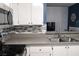 Modern kitchen with gray countertops and stainless steel appliances at 3150 Soft Breezes Dr # 2025, Las Vegas, NV 89128