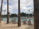 Beach access to a refreshing lagoon pool with lounge chairs and swimmers at 3150 Soft Breezes Dr # 2025, Las Vegas, NV 89128