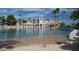 Relaxing lagoon pool with sandy beach and surrounding palm trees at 3150 Soft Breezes Dr # 2025, Las Vegas, NV 89128